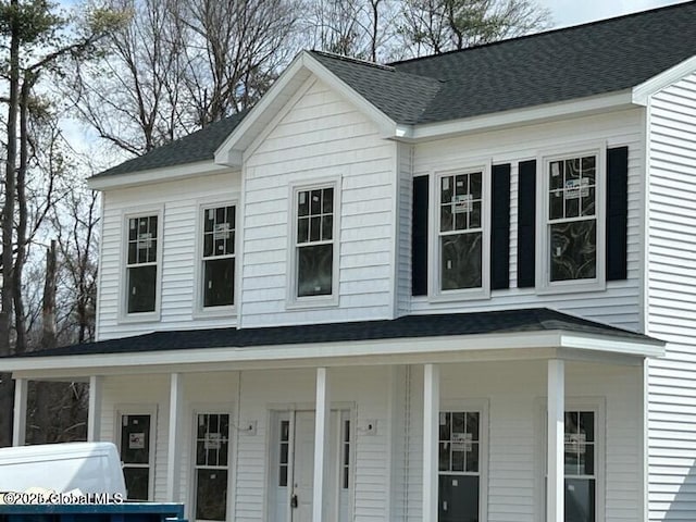 view of front of property with a shingled roof