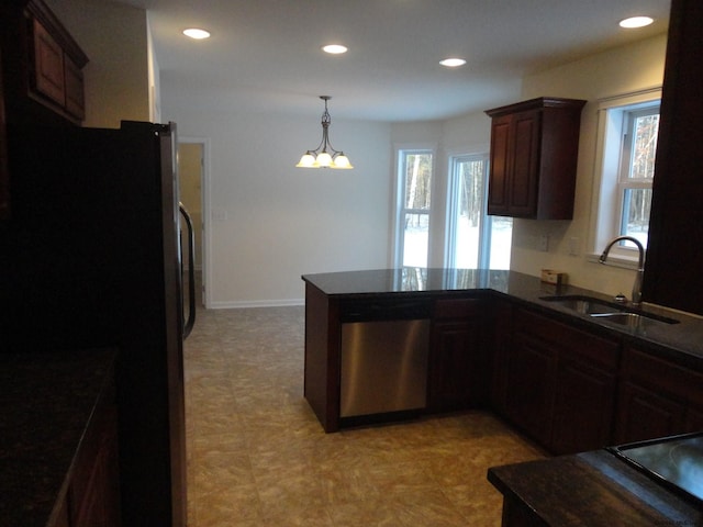 kitchen featuring a sink, recessed lighting, dark brown cabinetry, appliances with stainless steel finishes, and a peninsula