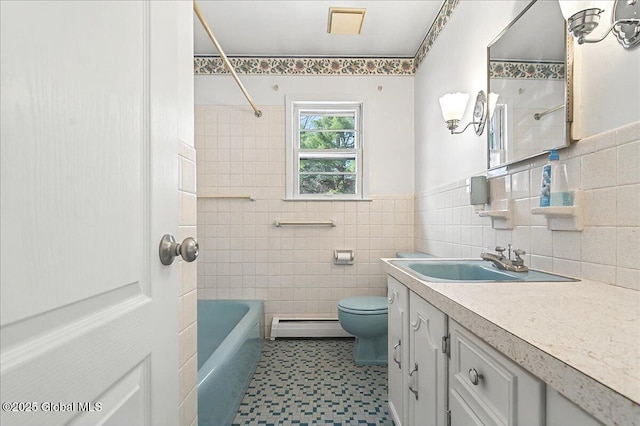 full bath featuring toilet, tile walls, vanity, and a baseboard radiator