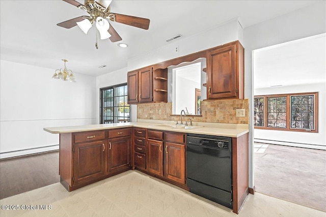 kitchen featuring visible vents, a sink, light countertops, dishwasher, and a baseboard heating unit