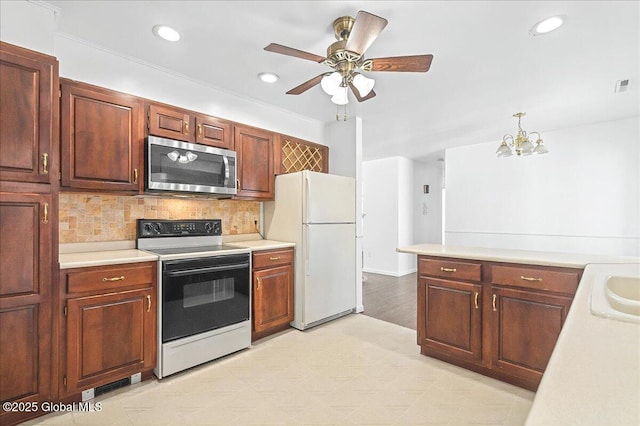 kitchen with white appliances, light countertops, and tasteful backsplash