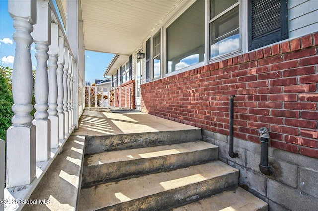 exterior space featuring brick siding