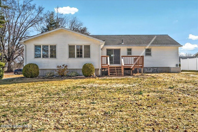 rear view of house featuring crawl space, a lawn, fence, and a wooden deck