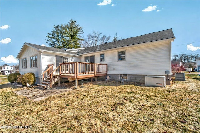 back of property with a deck and central air condition unit