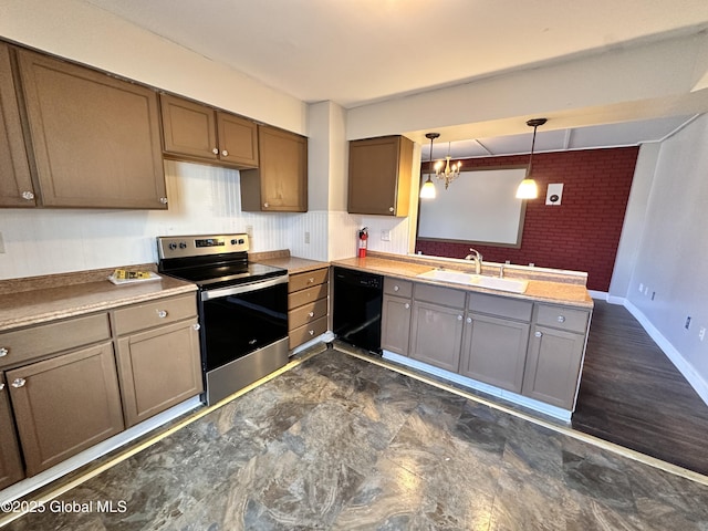 kitchen with a peninsula, electric range, a sink, dishwasher, and decorative light fixtures