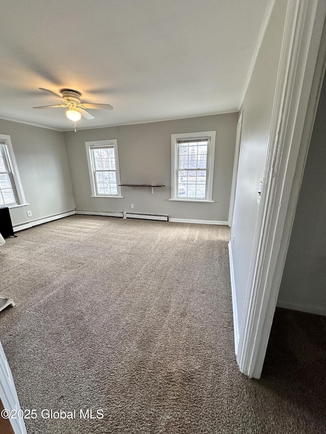 unfurnished living room with carpet flooring, baseboards, and ceiling fan