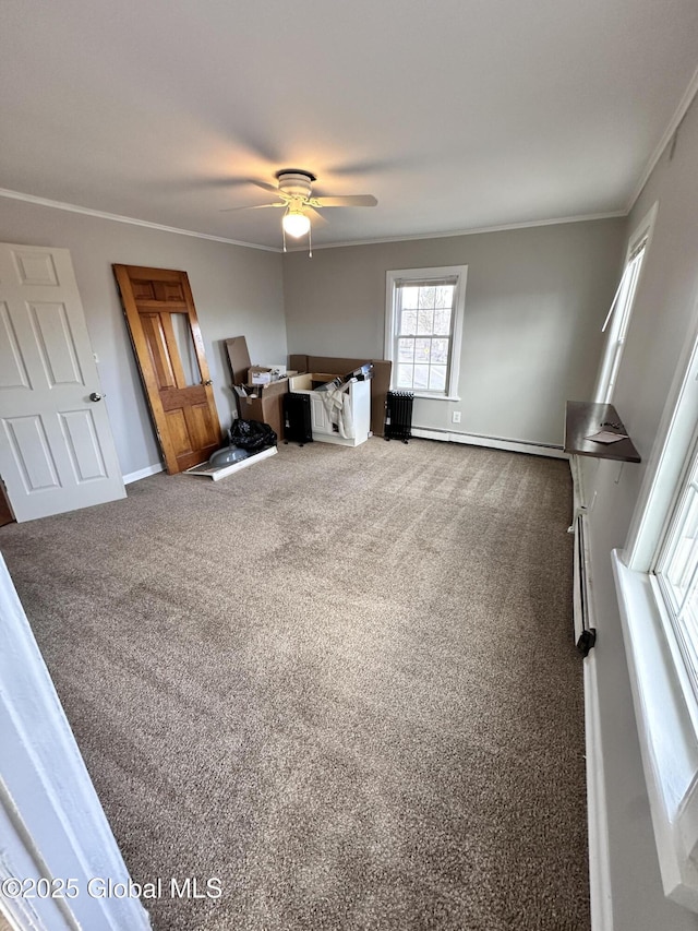 carpeted bedroom featuring a ceiling fan, baseboards, and ornamental molding