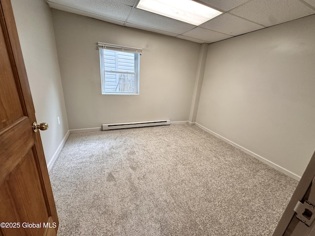 1 S Main St, Voorheesville, NY 12186 - empty room with baseboard heating, carpet floors, and a paneled ceiling