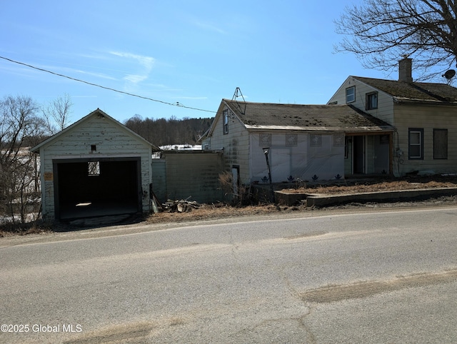 view of side of property featuring an outbuilding