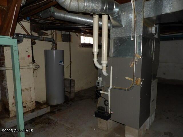 utility room featuring water heater and heating unit