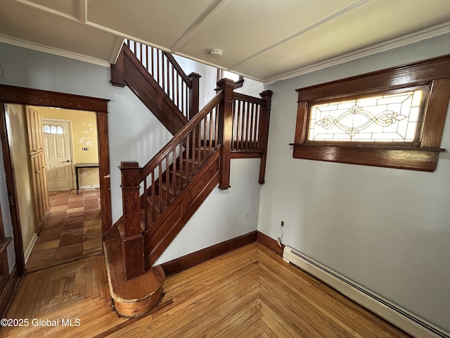 staircase featuring crown molding, baseboards, and a baseboard radiator