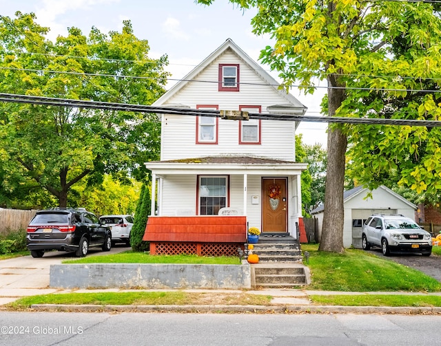 view of front facade featuring a front yard and covered porch