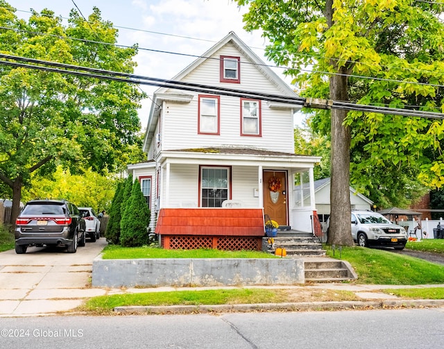 view of front of house with covered porch and driveway