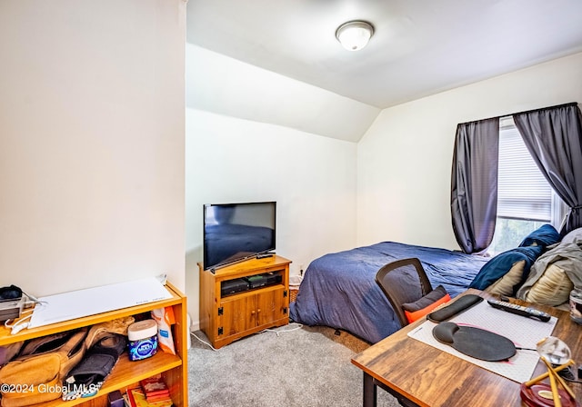 bedroom with carpet and lofted ceiling