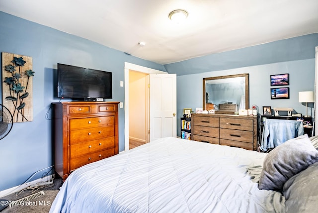 carpeted bedroom with baseboards