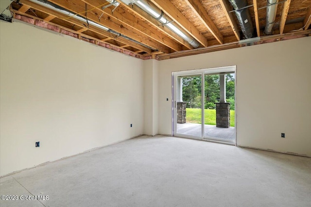 empty room with unfinished concrete floors