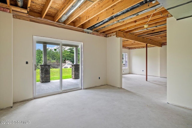 empty room featuring unfinished concrete floors