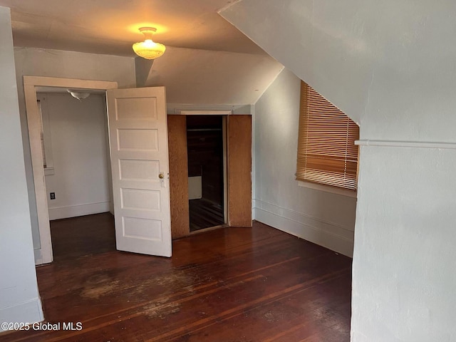 additional living space with hardwood / wood-style flooring and baseboards