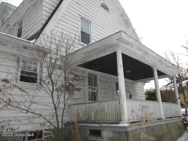 view of property exterior with covered porch