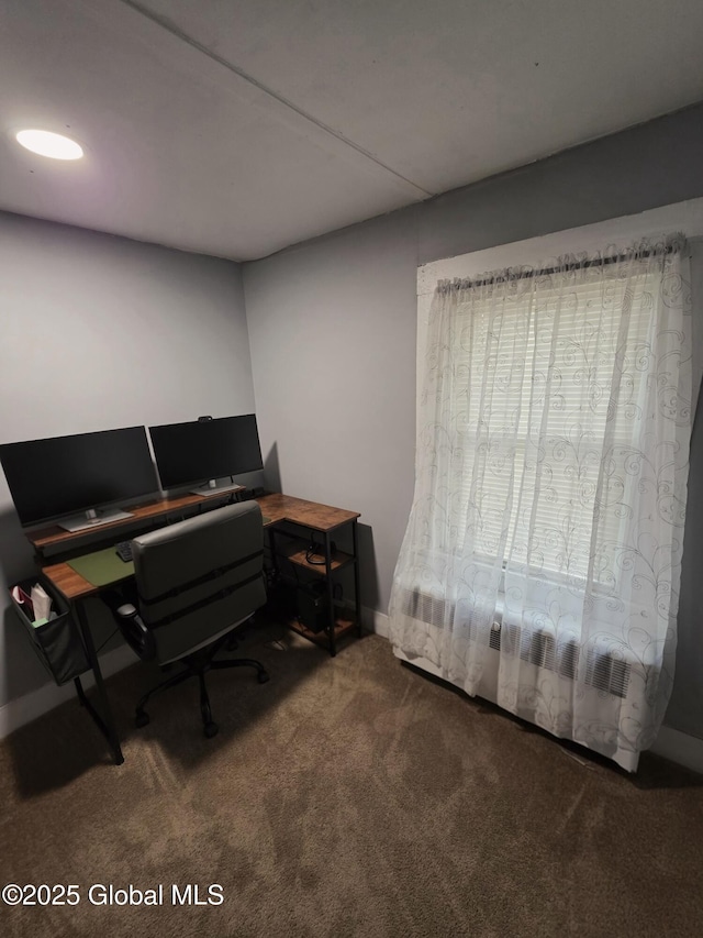 carpeted home office with baseboards