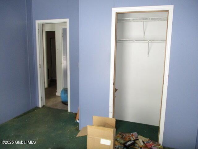 unfurnished bedroom with a closet