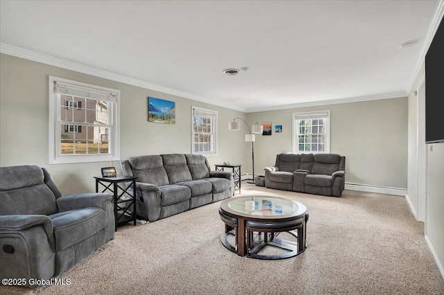 carpeted living area featuring visible vents, baseboards, and ornamental molding