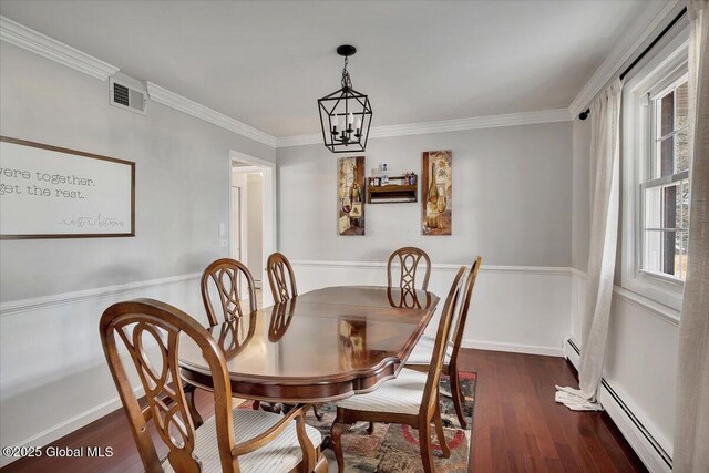 dining area featuring dark wood-type flooring, crown molding, visible vents, and a baseboard radiator