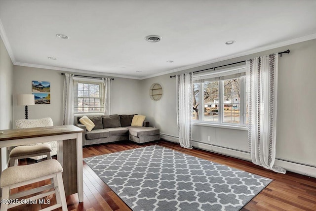 living area with visible vents, recessed lighting, wood finished floors, and ornamental molding