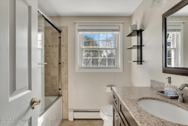 bathroom featuring tile patterned flooring, toilet, enclosed tub / shower combo, vanity, and a baseboard radiator