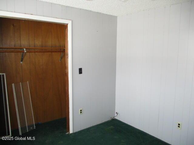 unfurnished bedroom with a textured ceiling