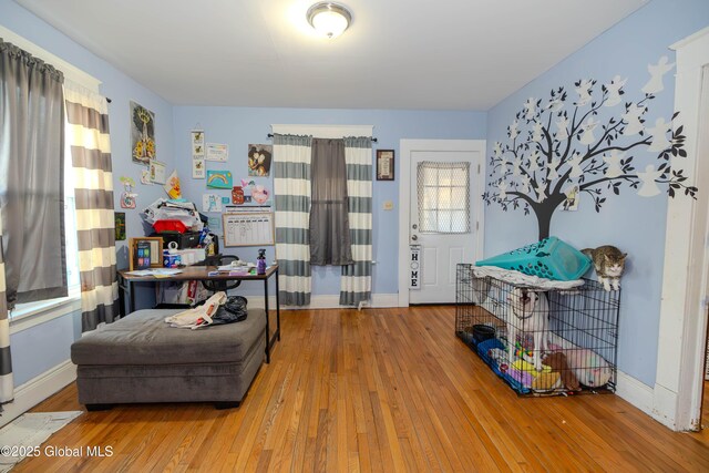 sitting room featuring baseboards and wood finished floors