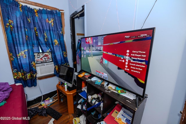 playroom featuring cooling unit and wood finished floors