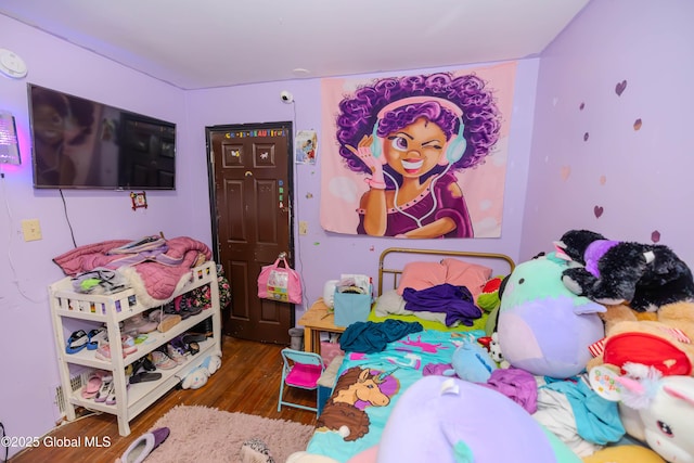 bedroom with wood finished floors