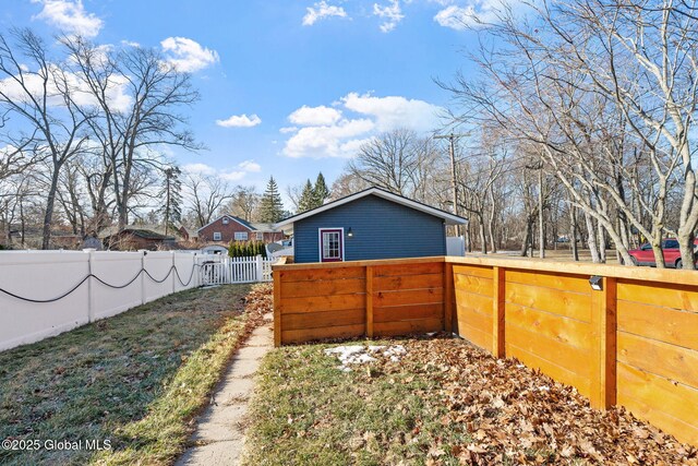 exterior space with a fenced backyard