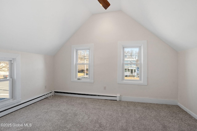 bonus room featuring a wealth of natural light, carpet, and vaulted ceiling