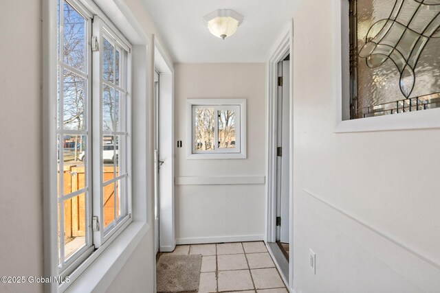 entryway with light tile patterned floors