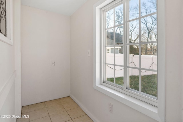 unfurnished room featuring light tile patterned floors