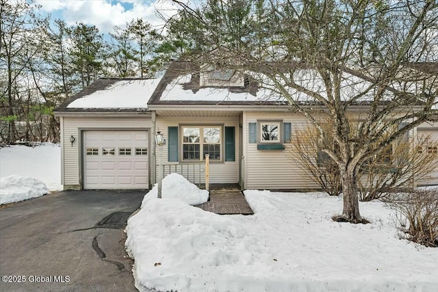 ranch-style home with an attached garage and driveway