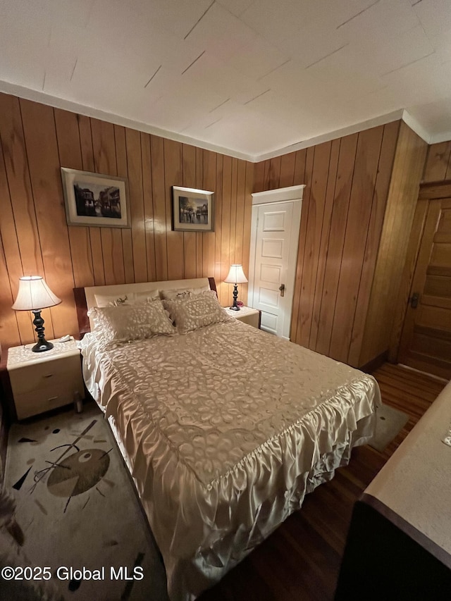 bedroom with wooden walls