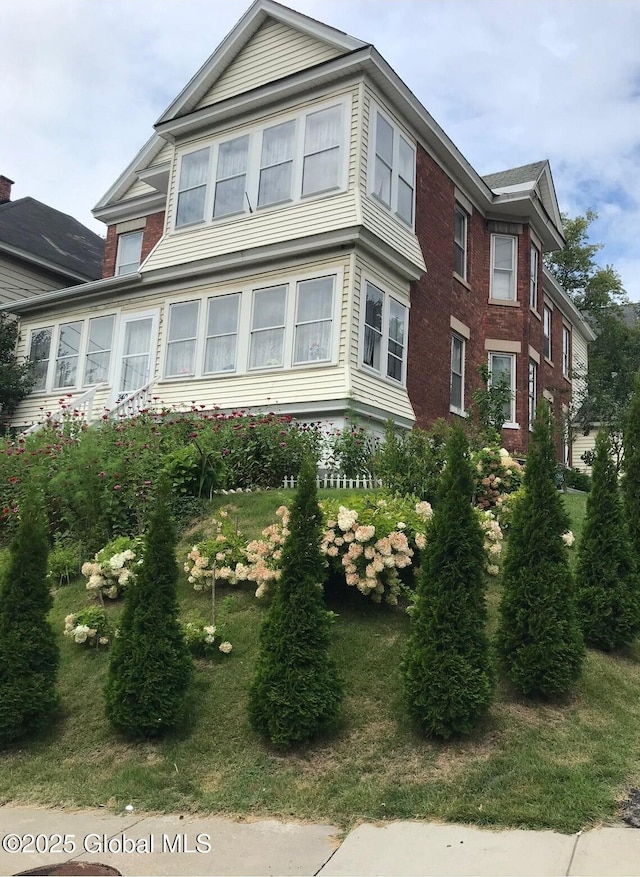 view of home's exterior featuring brick siding