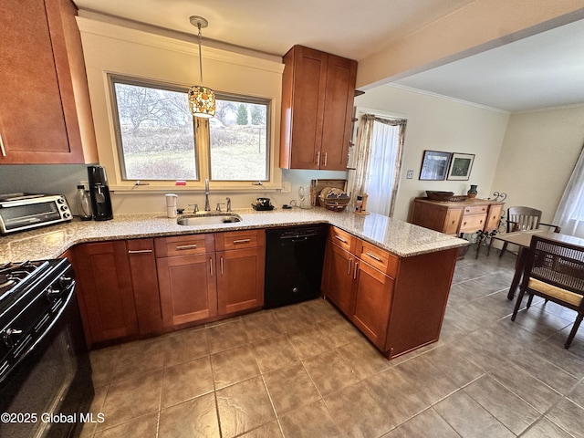 kitchen with brown cabinetry, a peninsula, a toaster, a sink, and black appliances