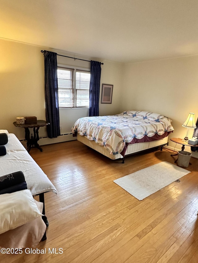 bedroom with wood finished floors