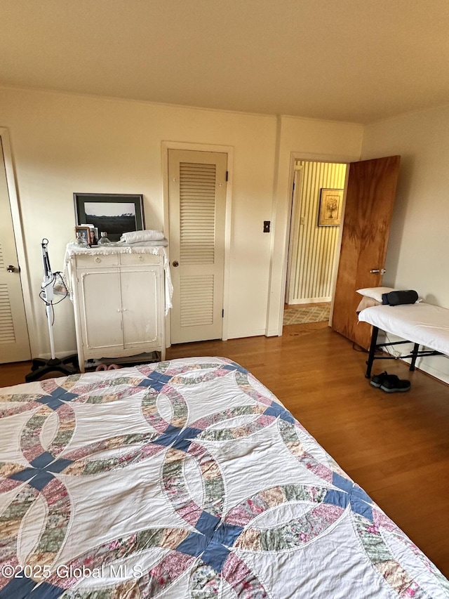 bedroom featuring wood finished floors