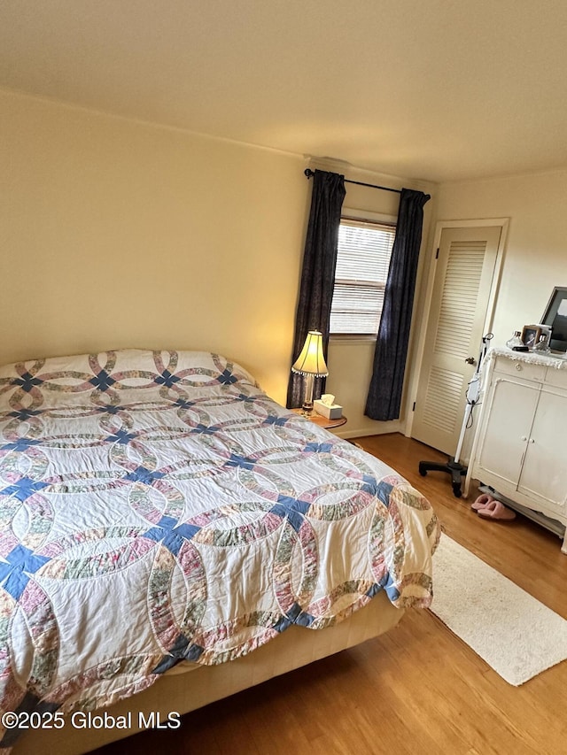 bedroom with light wood-type flooring