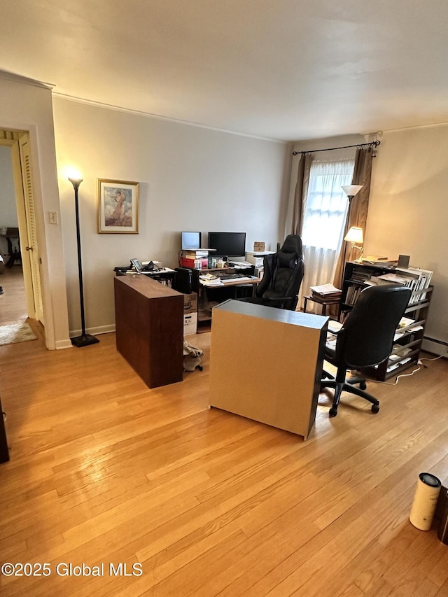 office with baseboards and light wood finished floors