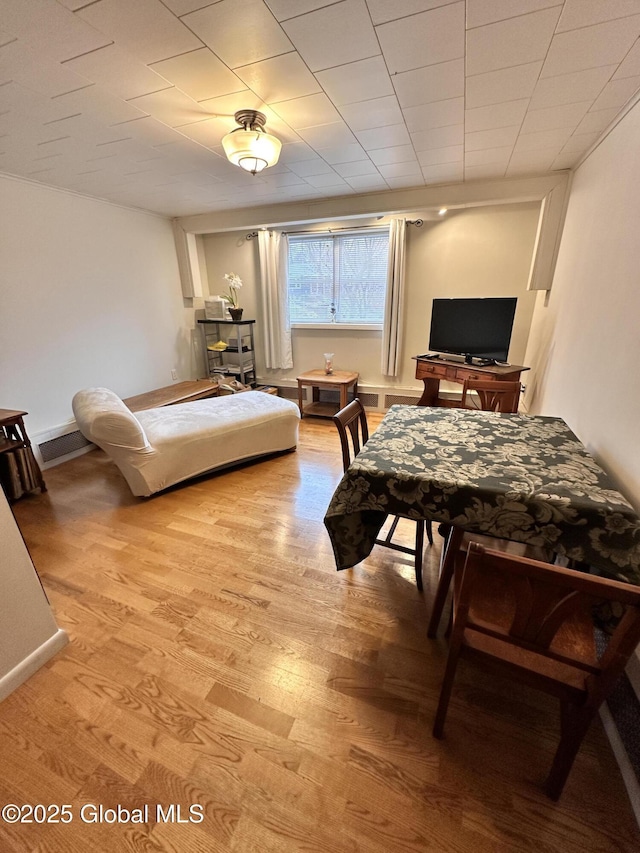 bedroom featuring visible vents, baseboards, and light wood-style floors