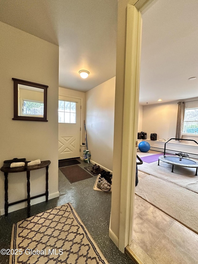 entrance foyer featuring baseboards