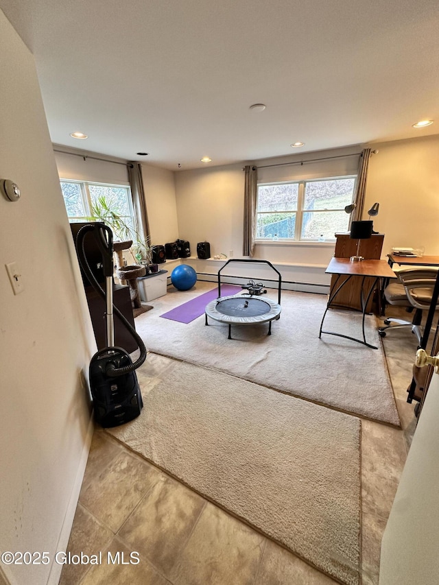 living room with carpet flooring, recessed lighting, baseboards, and a wealth of natural light