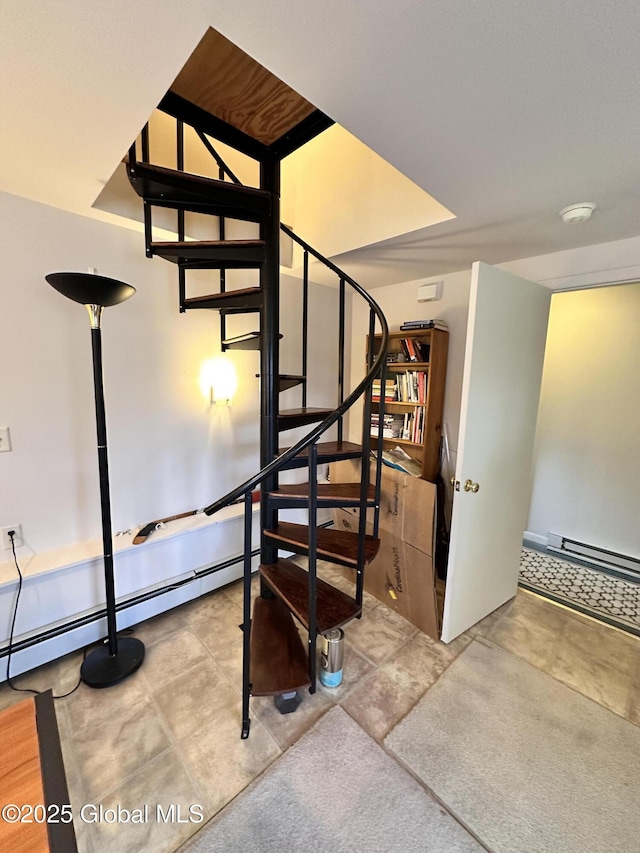 stairway with a baseboard heating unit