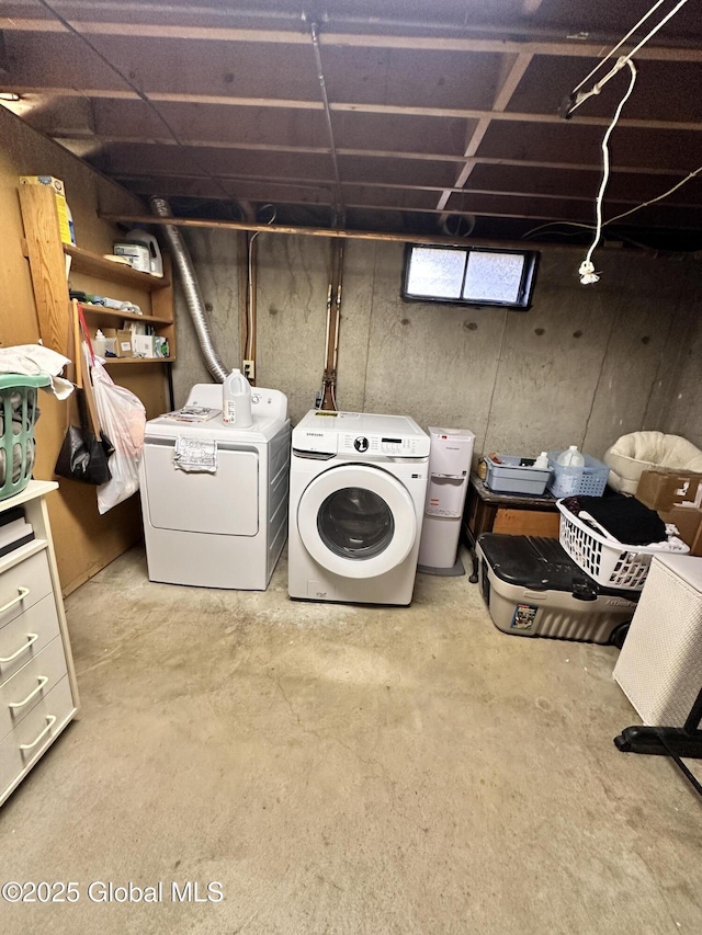 washroom featuring laundry area and washing machine and dryer